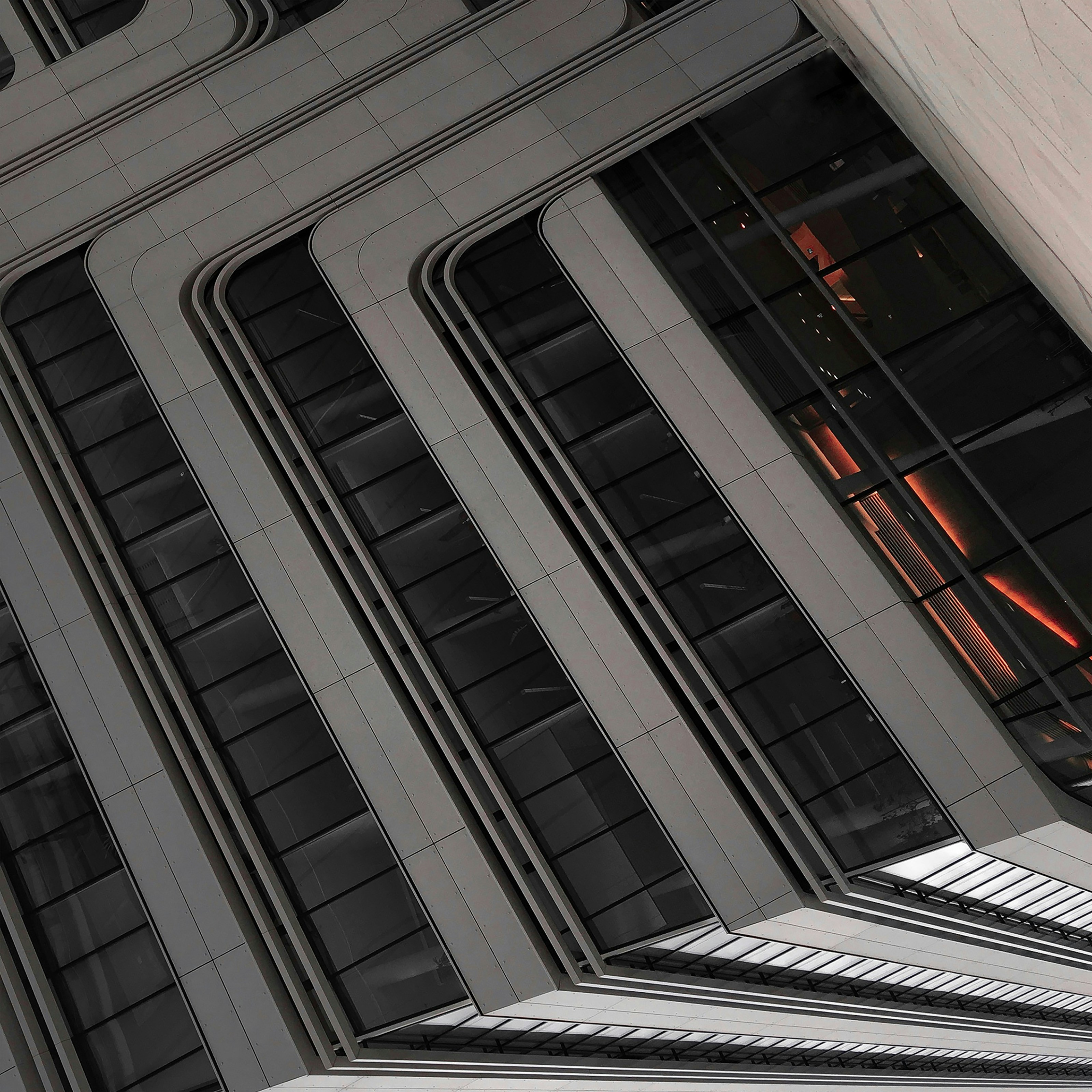 a clock on the side of a tall building