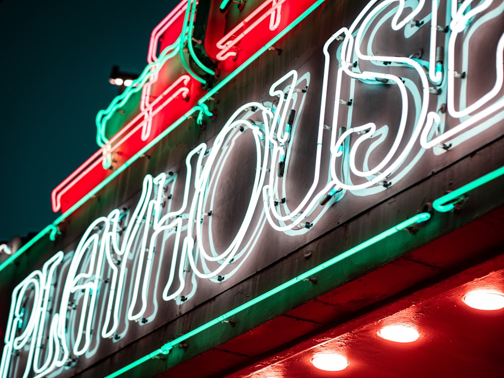 a close up of a neon sign on a building