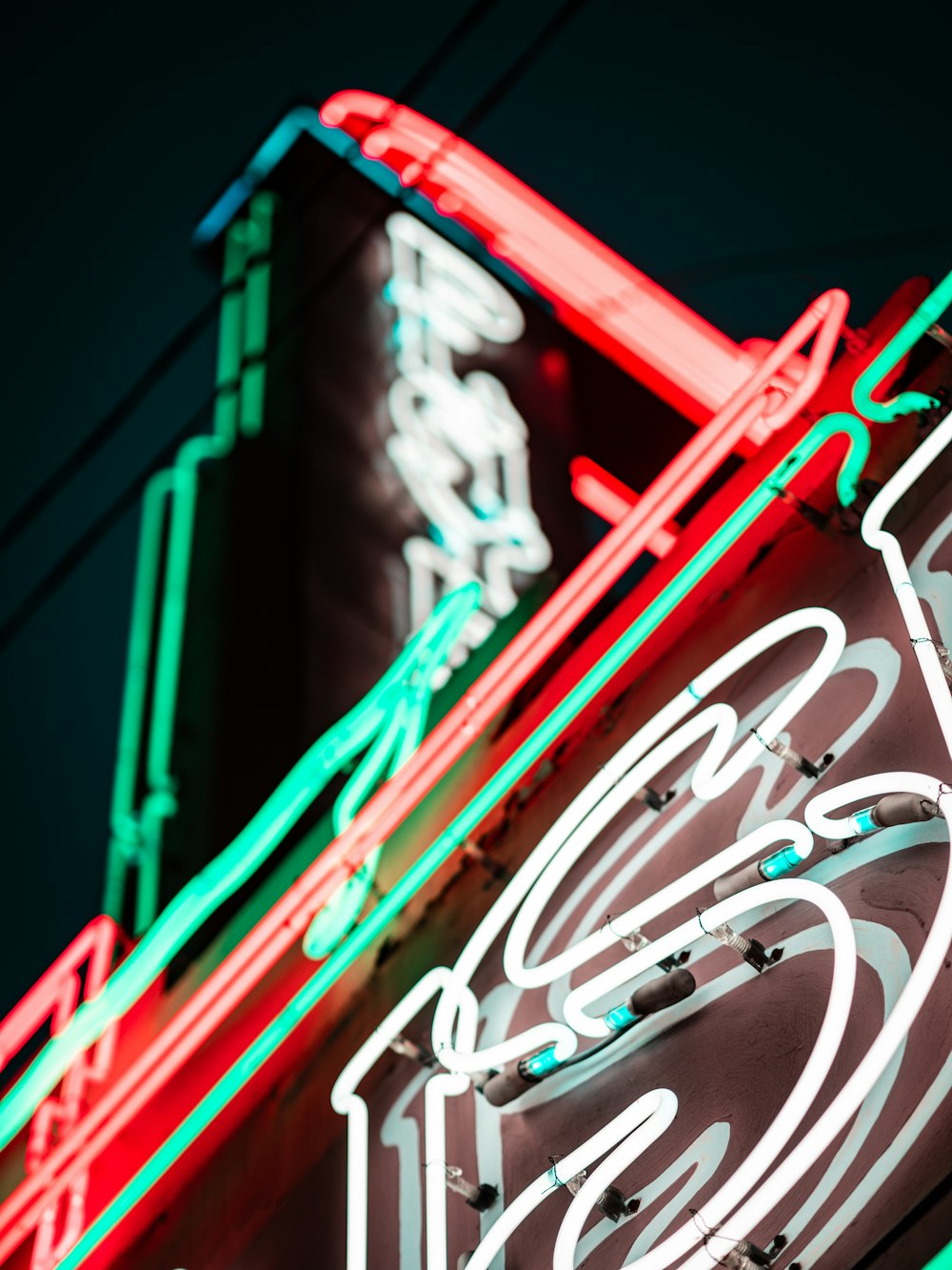 a neon sign on the side of a building