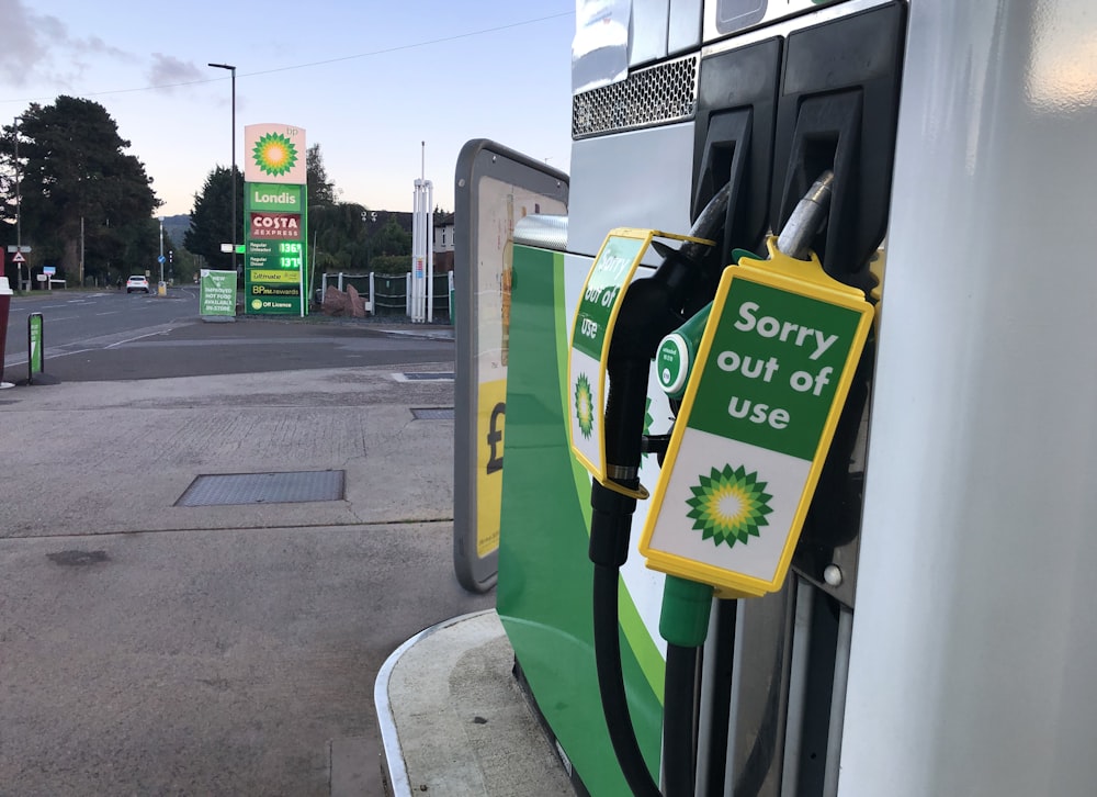 a gas pump with a sign saying sorry out of use