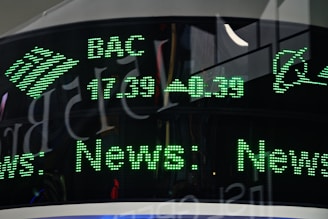 a close up of a clock with green numbers