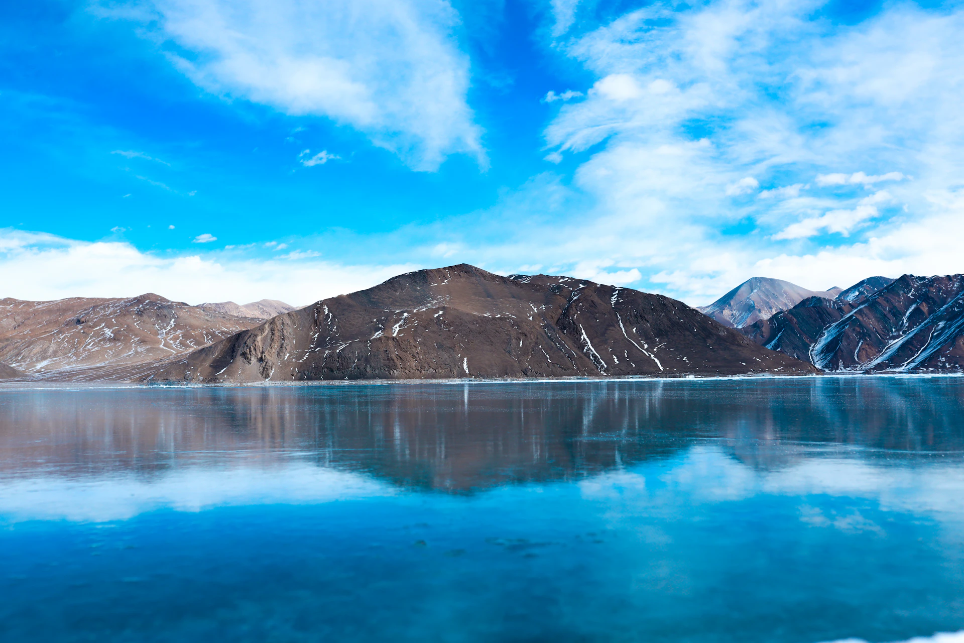 a large body of water surrounded by mountains