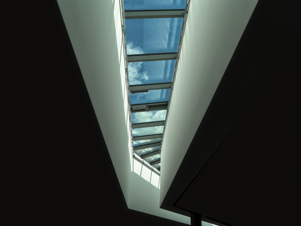 a view of the sky through a window in a building