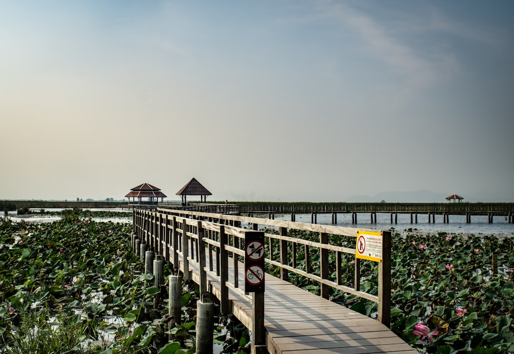 a wooden bridge over a large body of water