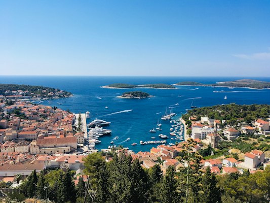 A view of a harbor with boats in the water — Hvar, Croatia