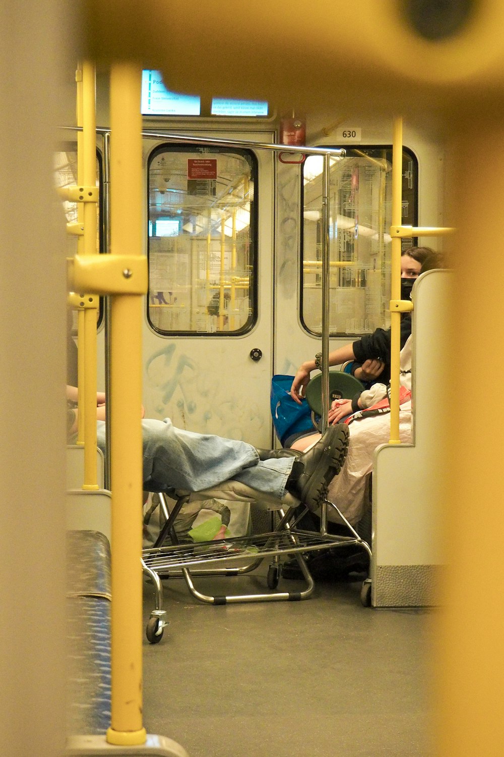 a person laying on a bed on a train