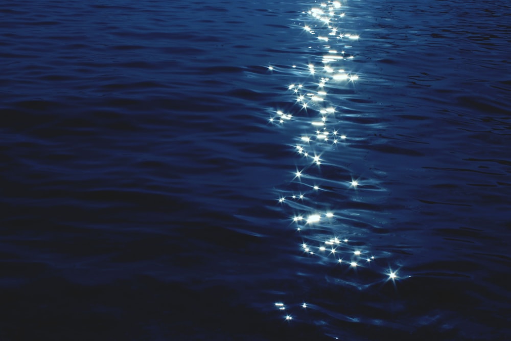 a long line of lights in the water