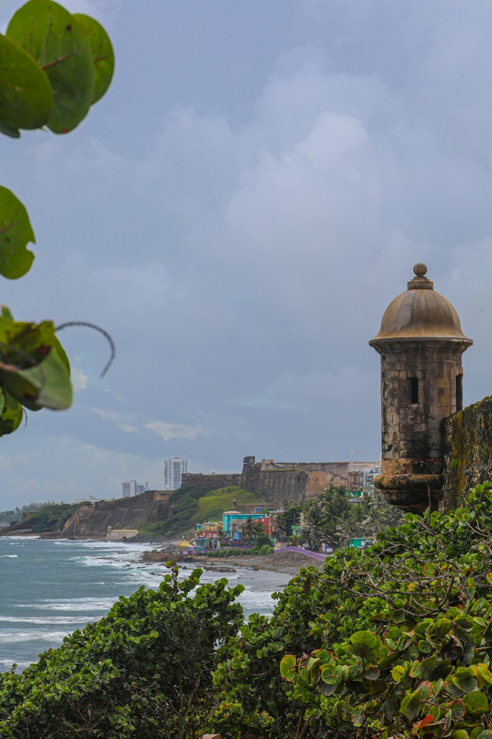 a view of the ocean with a tower in the foreground