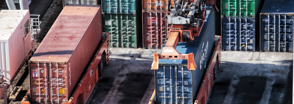 cargo containers are stacked on top of each other