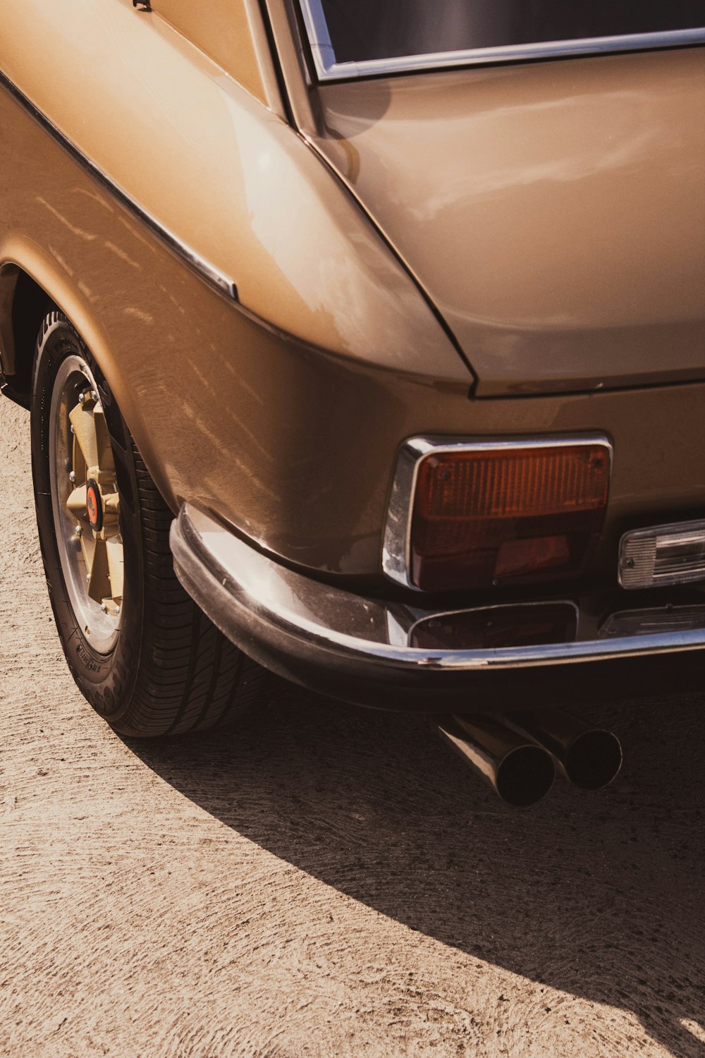 a brown car parked on the side of the road