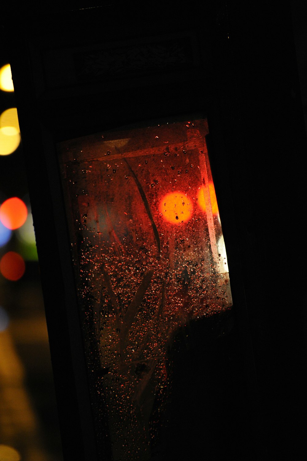 a traffic light with a red light in the background