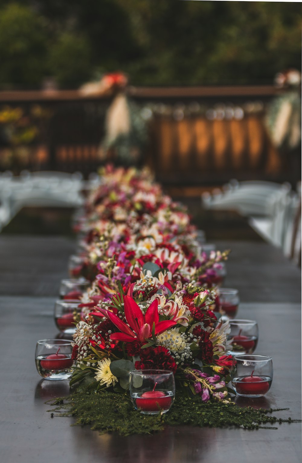 a long table with candles and flowers on it