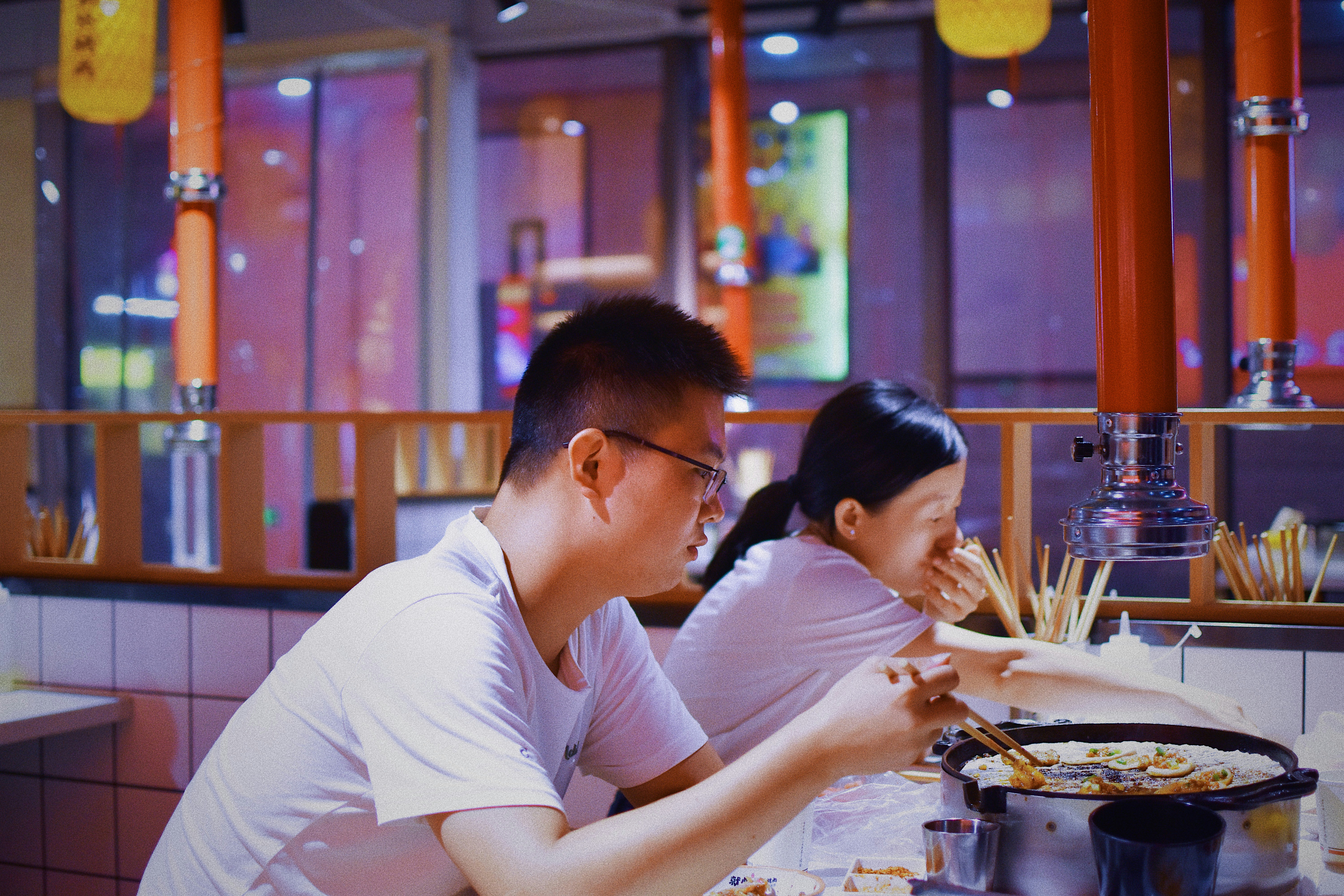 couple enjoying a meal at a sophisticated restaurant - best sushi Uptown Chicago