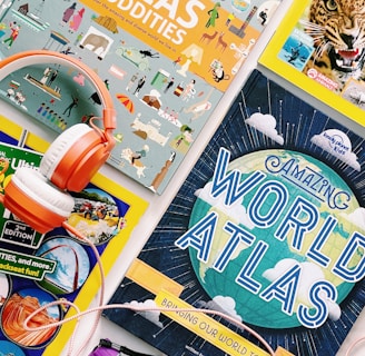 a table topped with books and headphones