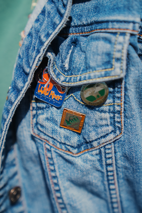 a close up of a person wearing a jean jacket