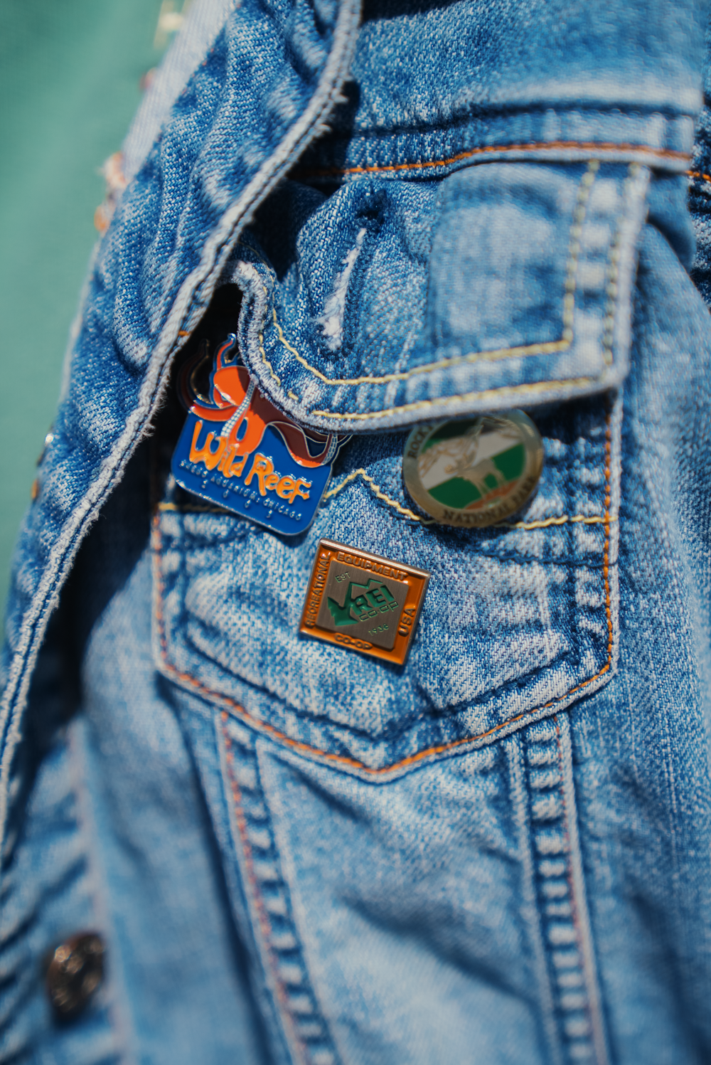 a close up of a person wearing a jean jacket