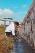 Youth researchers taking water samples from a mountain stream.