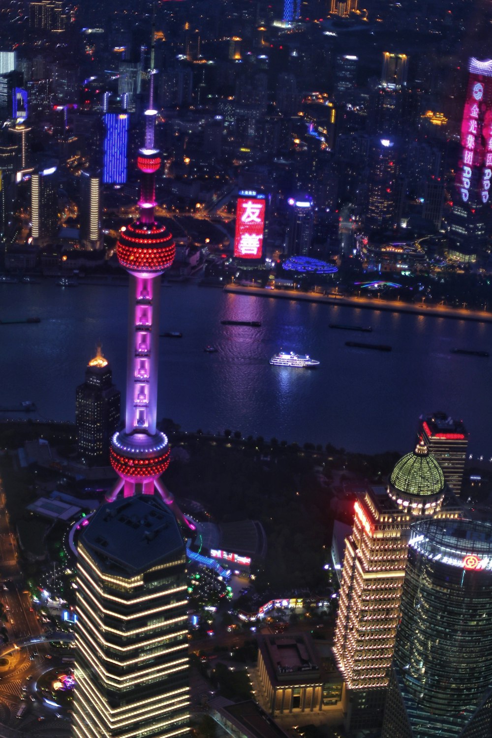 a view of a city at night from the top of a building