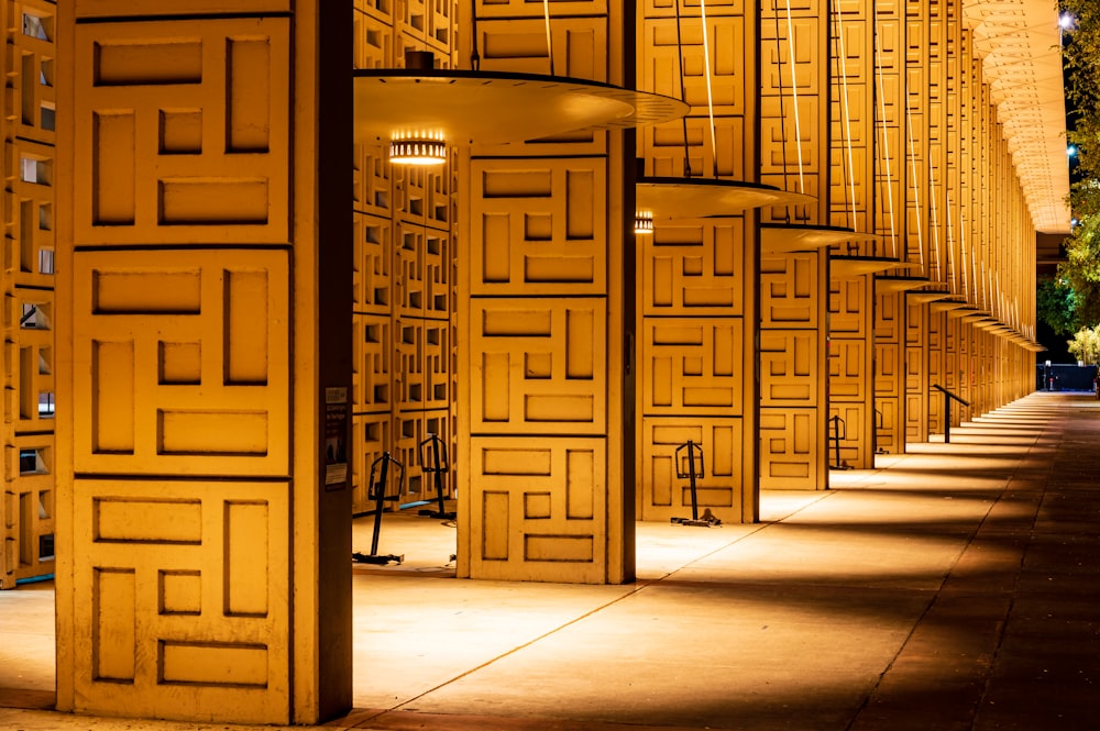 a row of yellow doors on the side of a building