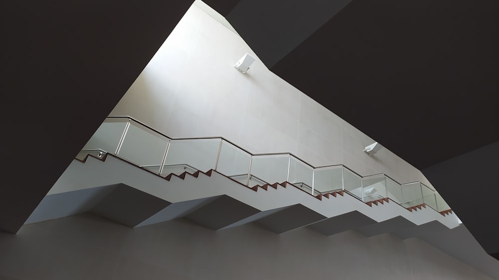 a stair case in a building with a skylight above it