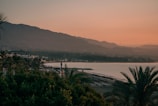 a view of a body of water with mountains in the background