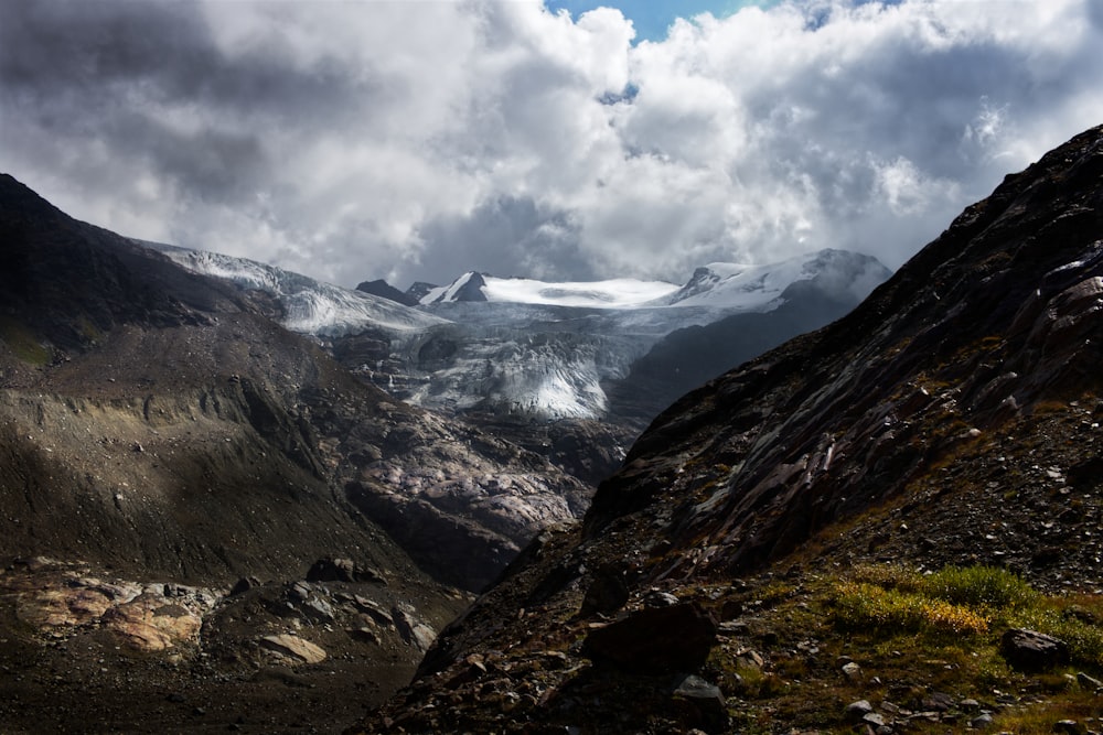 a view of a mountain range with snow on the mountains