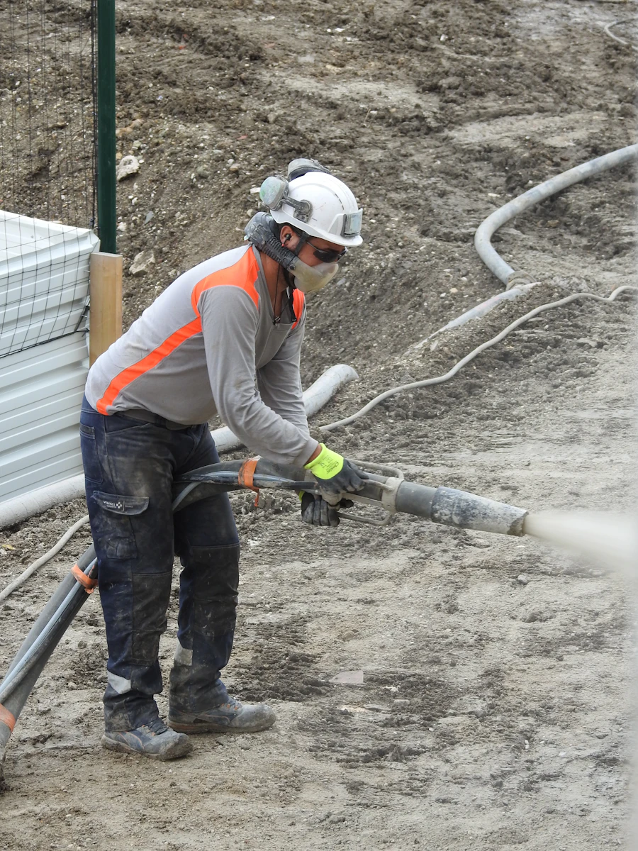 Field worker operating equipment at a job site