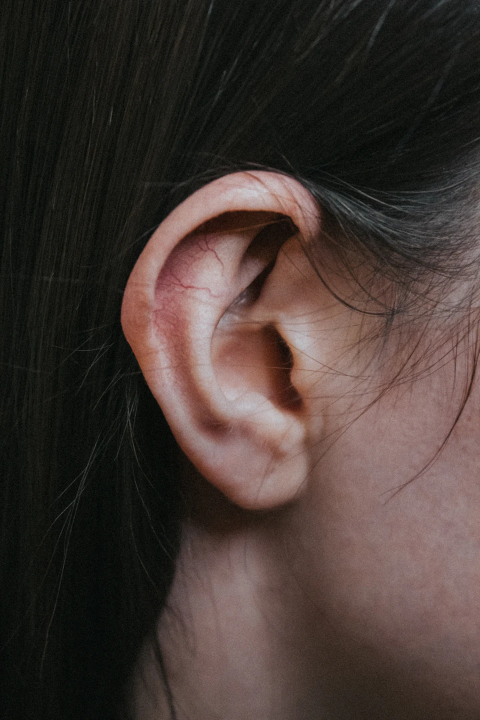 Close-up view of ear with focus on right ear canal and outer ear detail