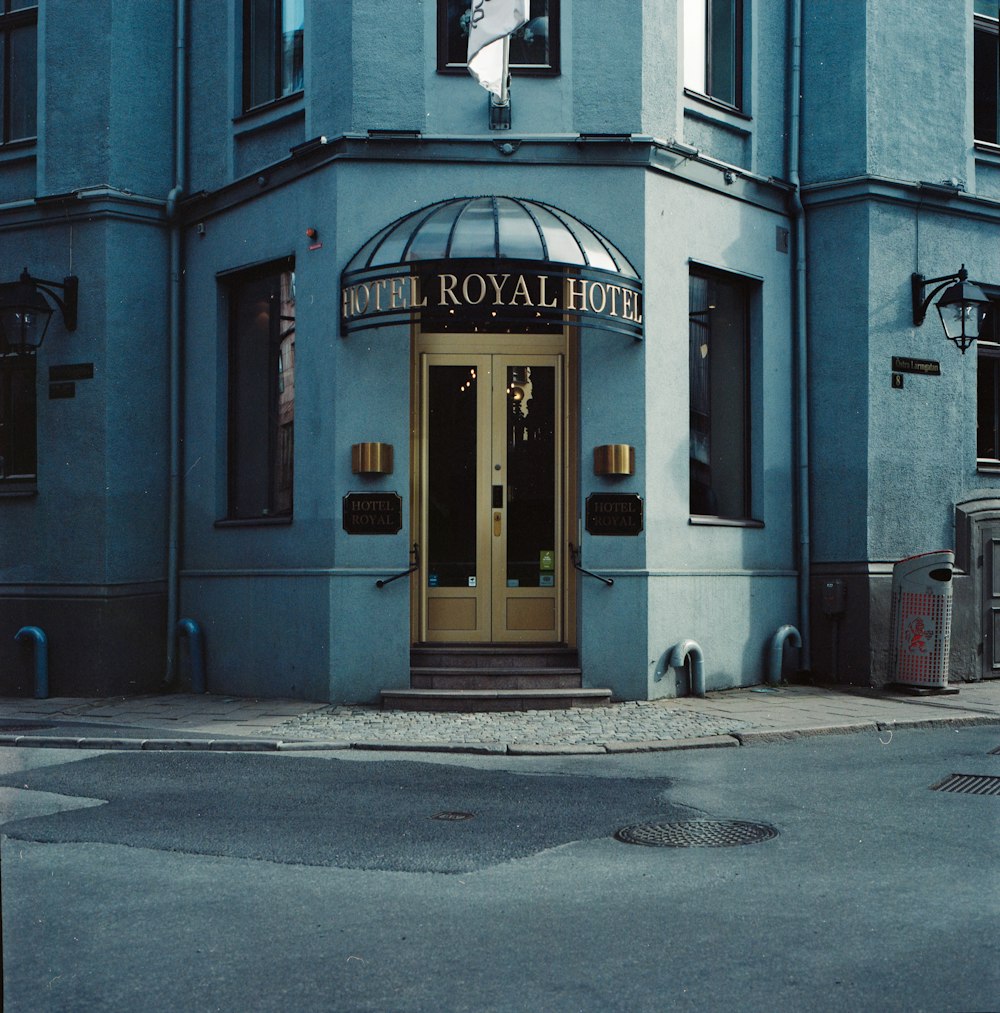 a blue building with a clock on the front of it