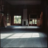 A professional team carefully clearing out a spacious Barcelona apartment with natural light.