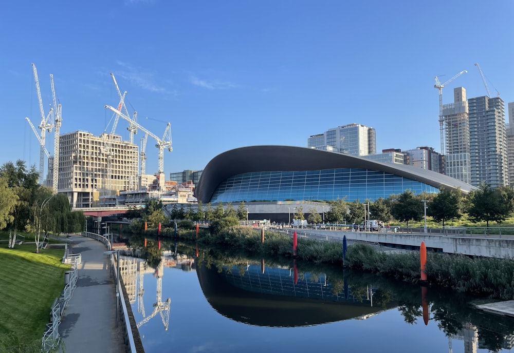 a river running through a city next to tall buildings