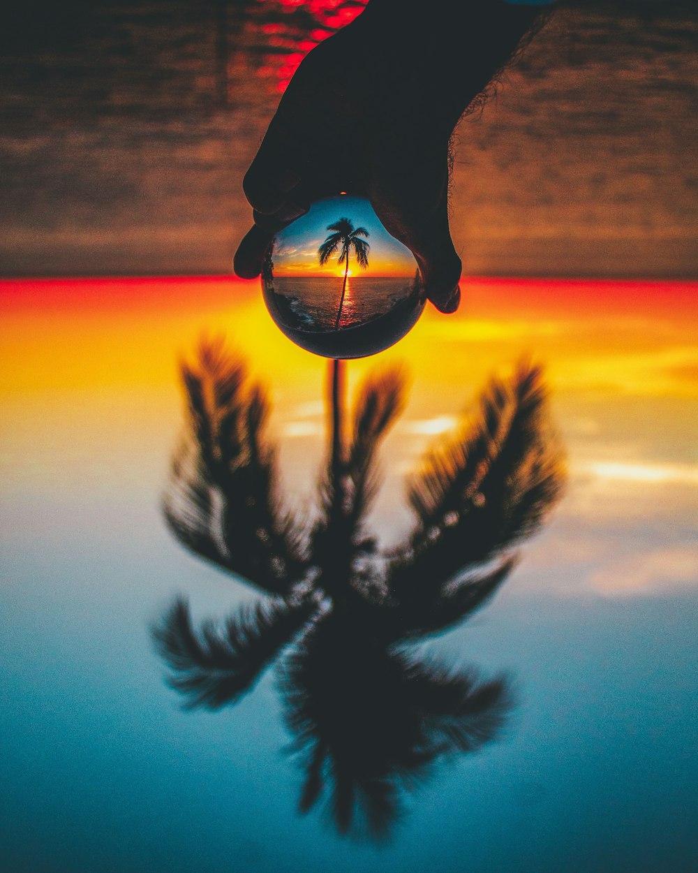 a person standing in front of a sunset