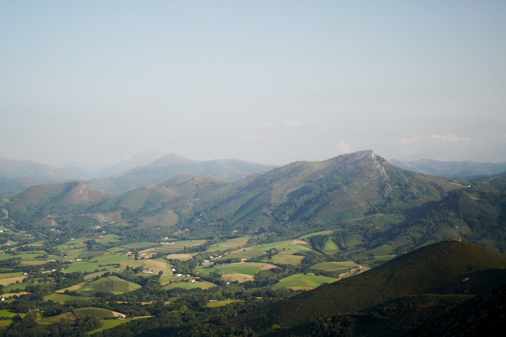 a view of a valley and mountains from a plane