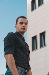 a man standing in front of a building