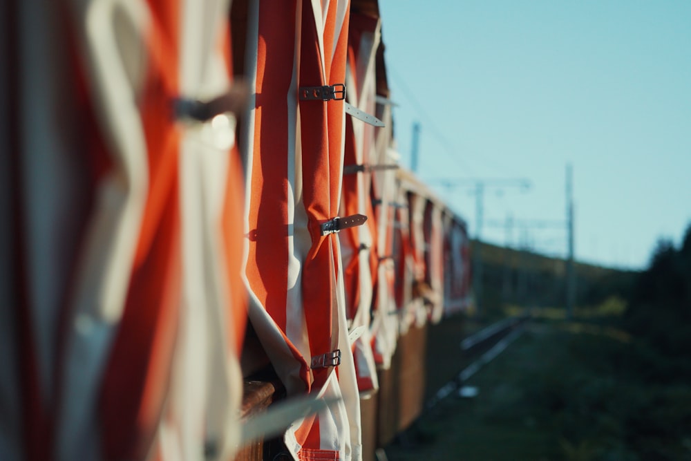 a row of orange and white striped umbrellas