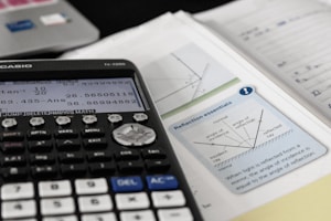 calculator and open high school physics textbook