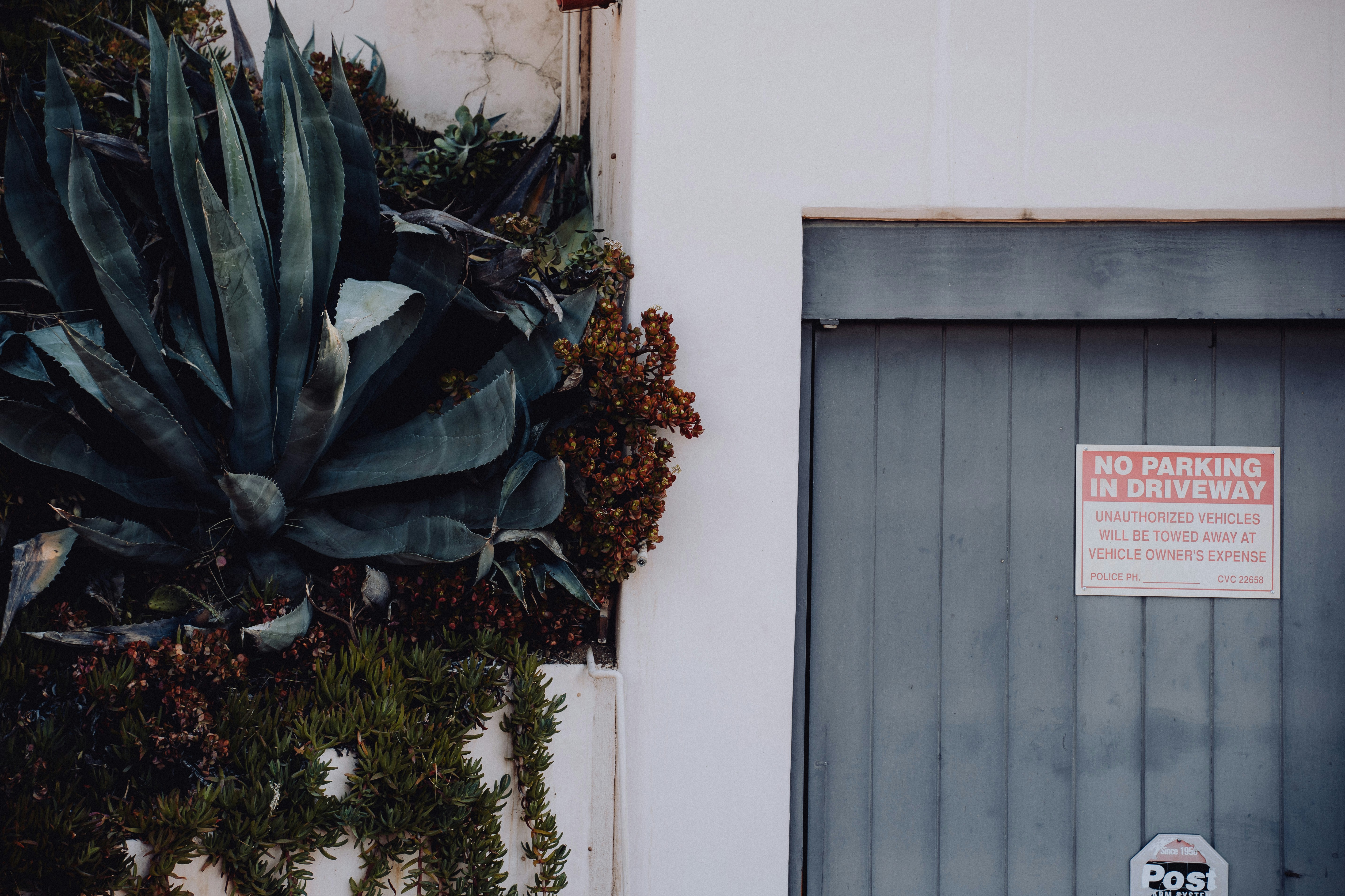 a no parking sign next to a door