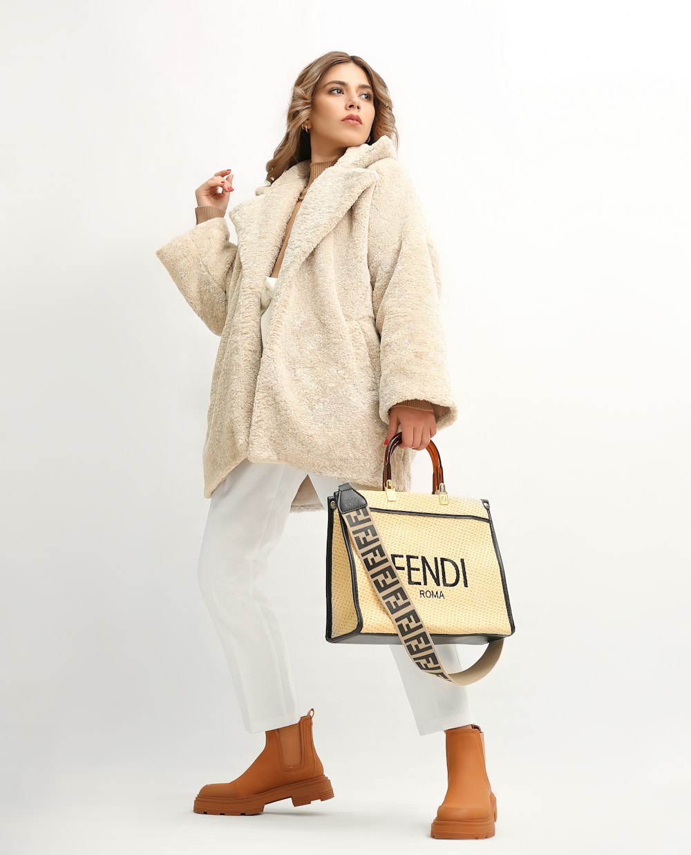 a woman in a fur coat holding a fendi bag