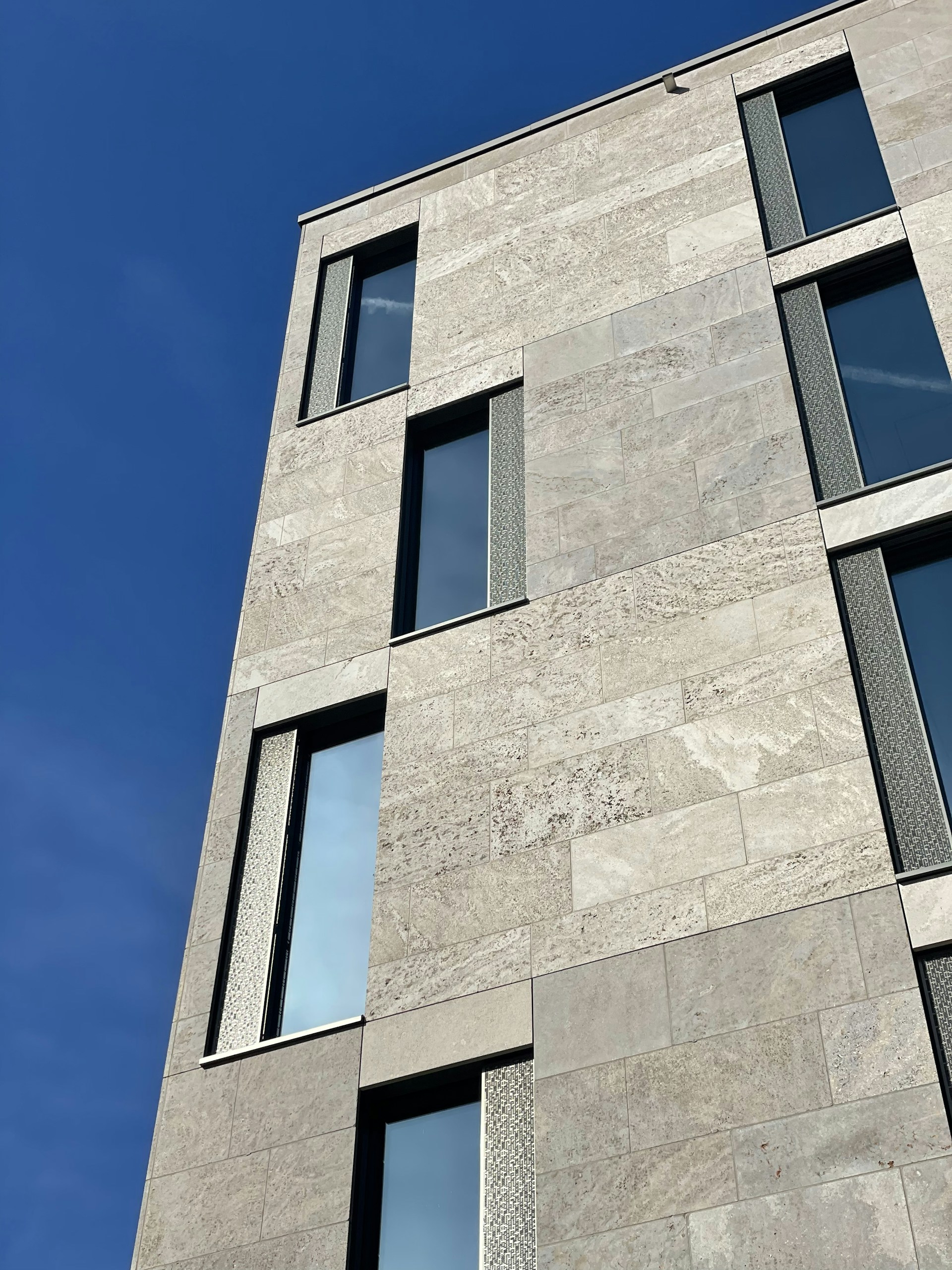 a very tall building with some windows on it