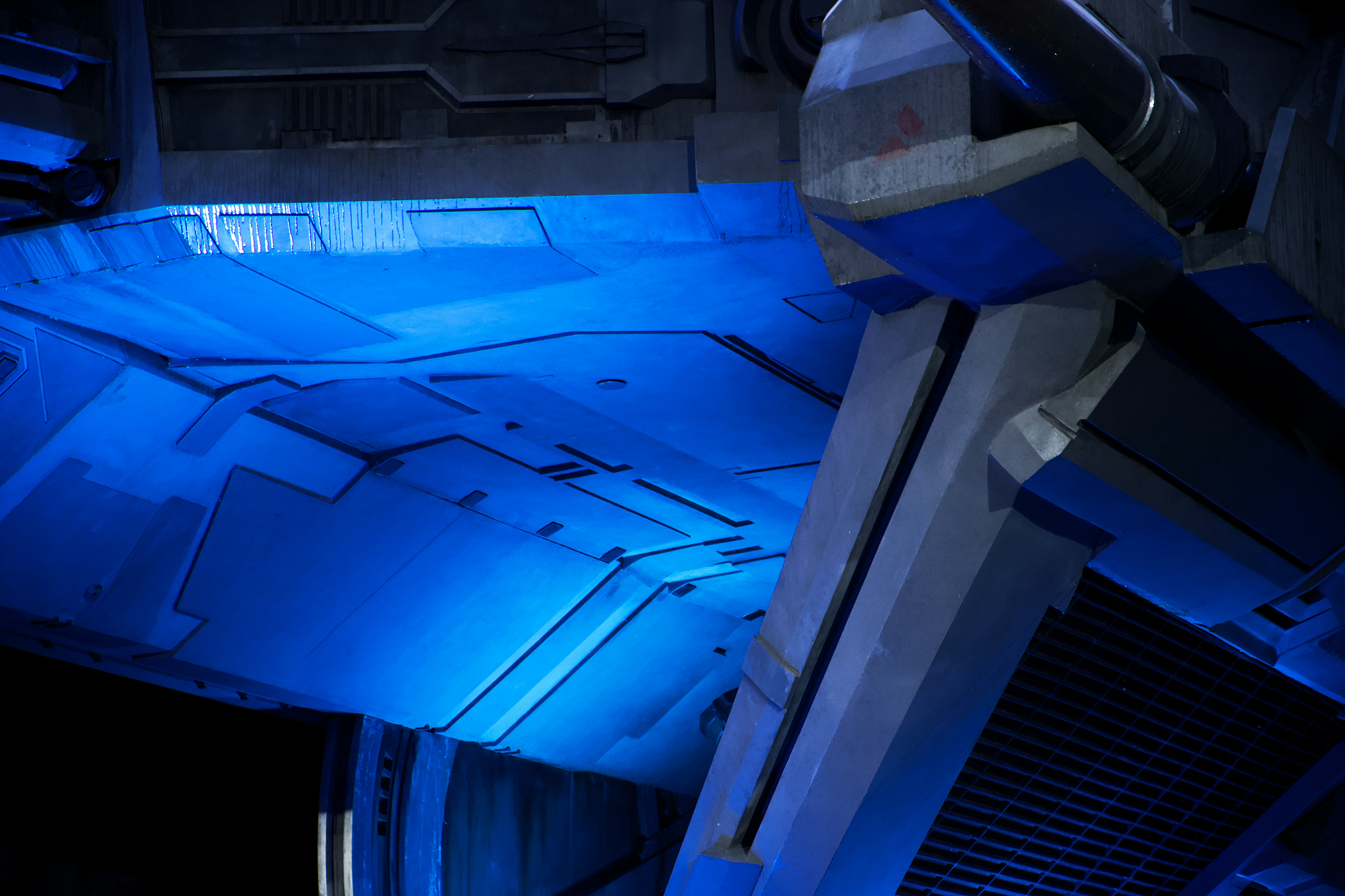 a blue light shines on the side of a building, Exterior of a First Order TIE Echelon, Hollywood Studios