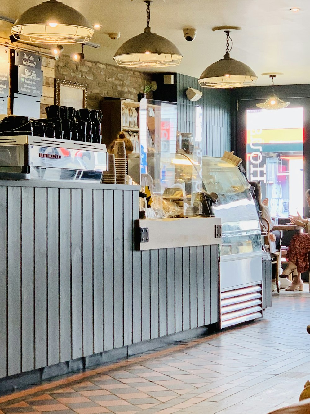 a person sitting at a table in a restaurant