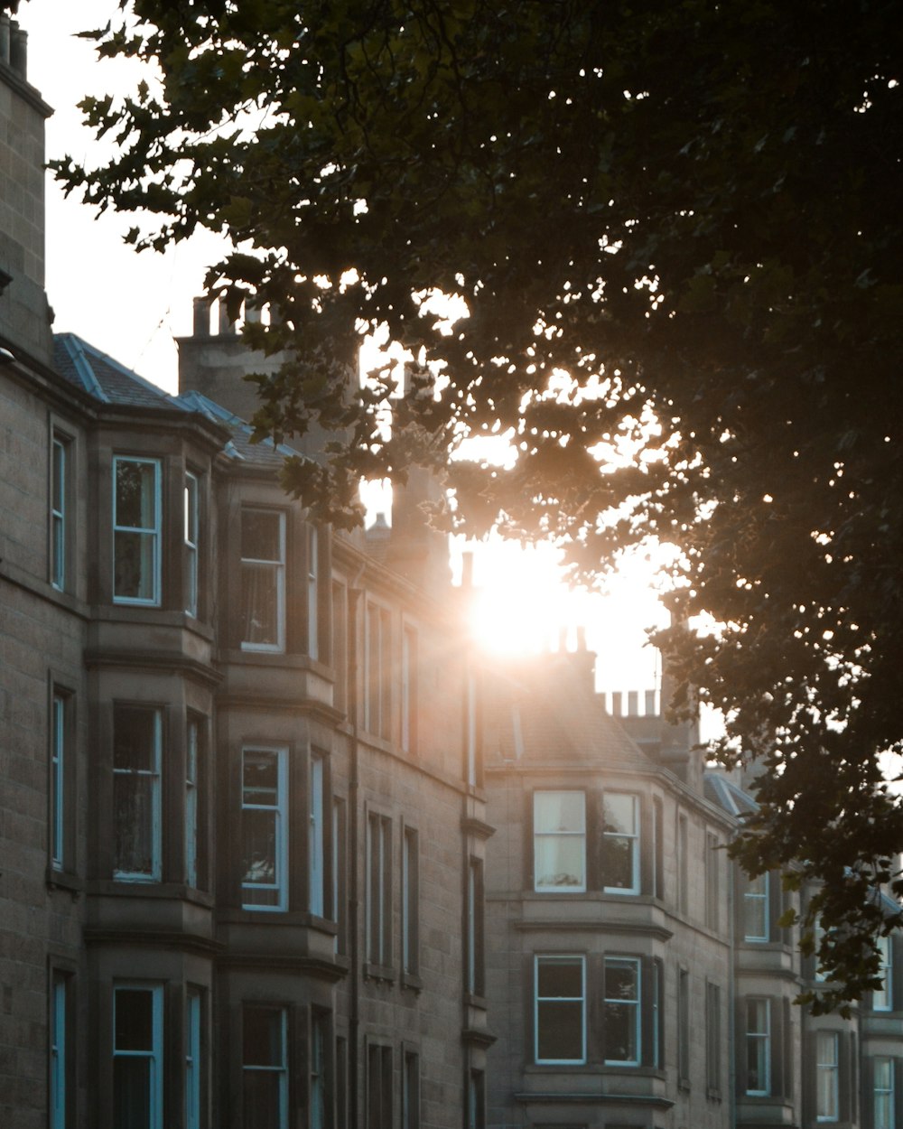 the sun is shining through the windows of a building