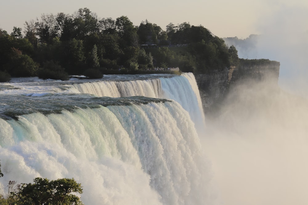 a large waterfall with water pouring out of it