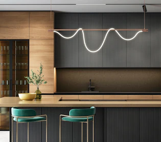 a modern kitchen with a bar and stools kitchen renovation los cabos modern design