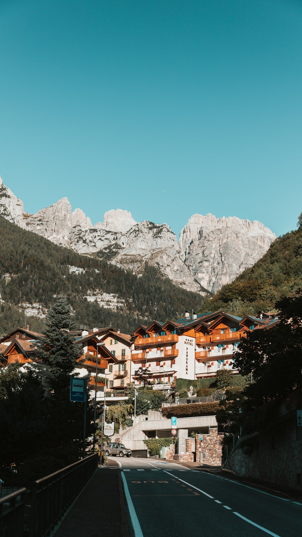 a street with mountains in the background