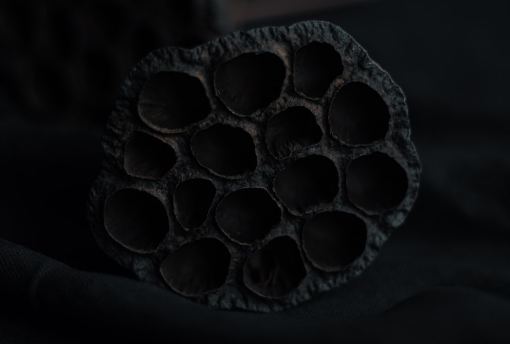 a group of chocolates sitting on top of a black surface