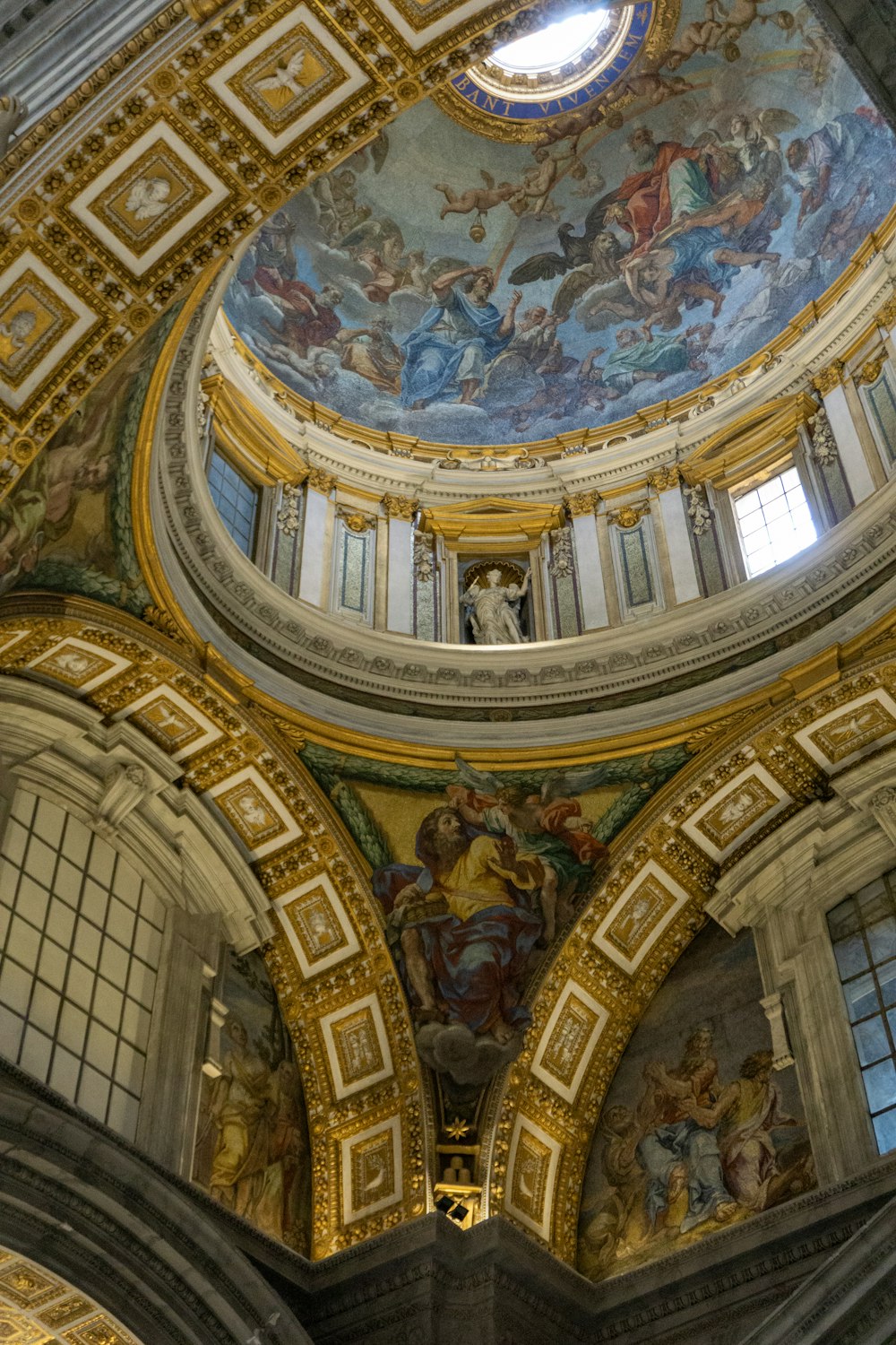 the ceiling of a building with paintings on it