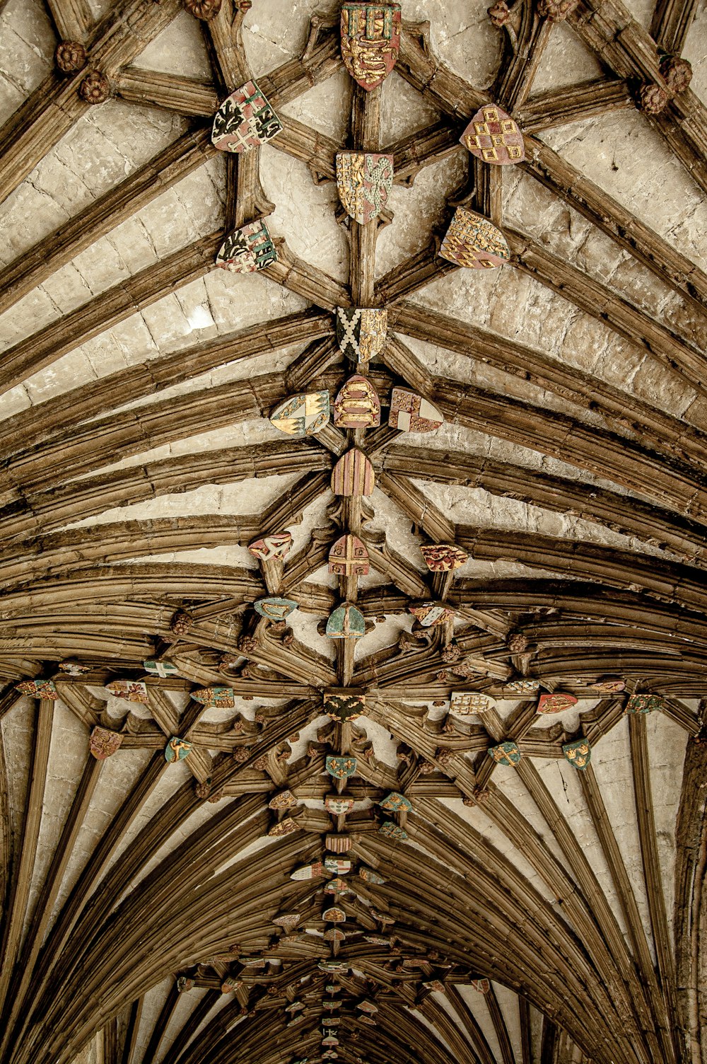 the ceiling of an old building with wooden beams