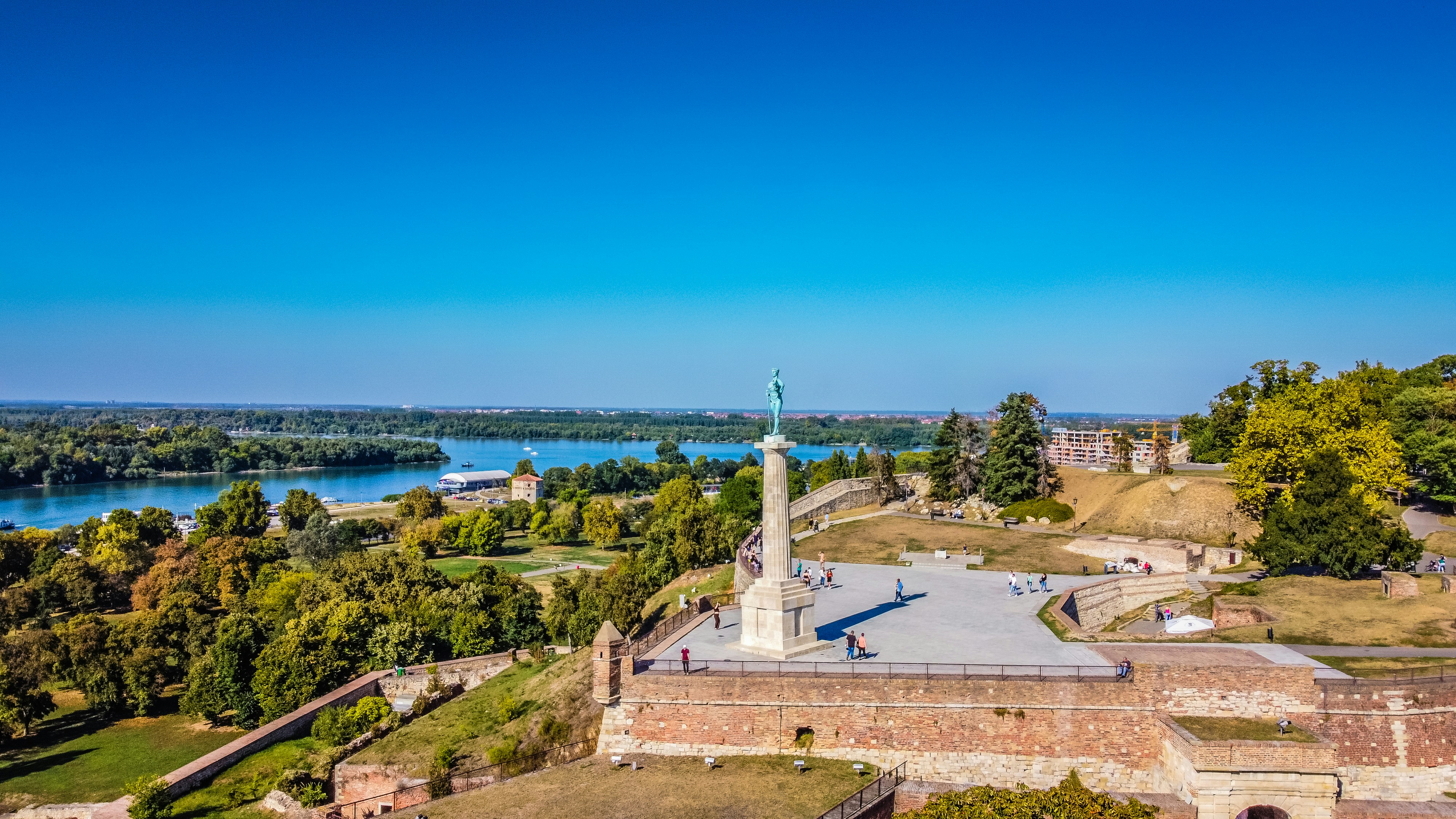 an aerial view of a monument in the middle of a park