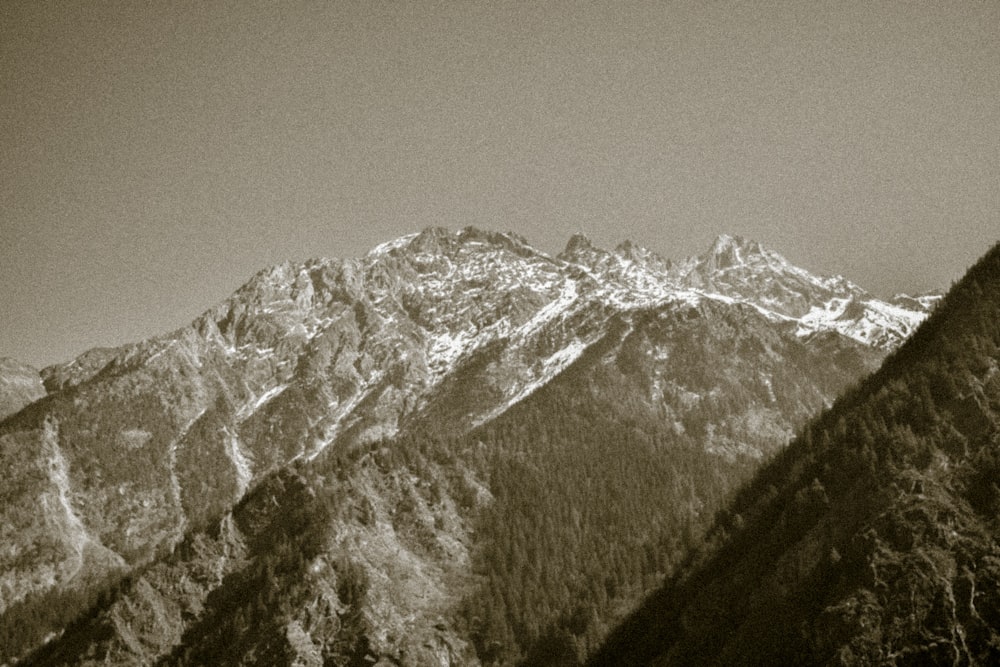 a black and white photo of a mountain range